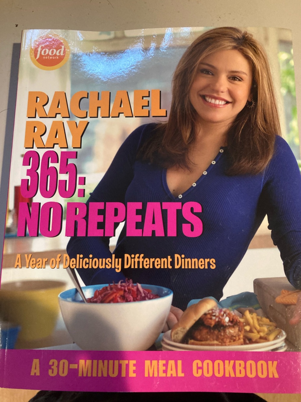 Rachael Ray cover with orange background and pink title text